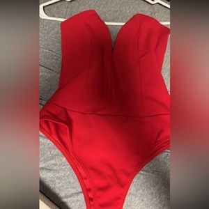 Strapless red body suit